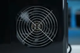 A close up of the ventilation fan of a countertop ice making appliance.