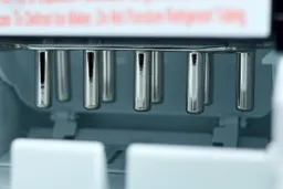 A close up view of ice rods of a countertop bullet ice making machine.