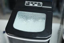 The lid of the AGLucky countertop ice maker showing much condensation after an 8-hour period.