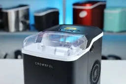 Close up view of a portable ice maker with its lid closed.