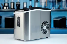 A side view of the stainless steel body of the EUhomy countertop ice maker.