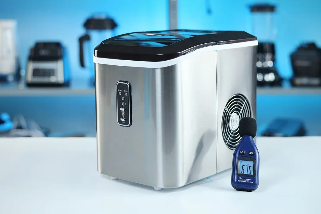The Euhomy portable ice maker operating on a countertop with a sound meter showing 67.5 decibels.