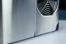 A close up view of an extractor fan found on a portable countertop ice maker.