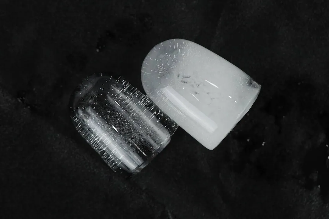 A side by side comparison of a small ice bullet above and a large ice bullet below set against a dark background.