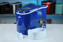 The navy blue Vivo Home portable ice maker pictured with the ice basket and ice scoop in front.