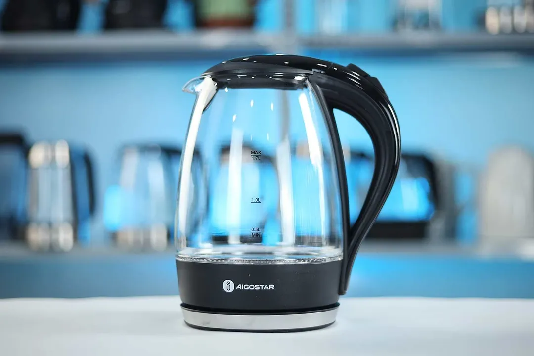 The carafe of the Aigostar Electric Kettle 300104LCB sitting on top of its power base.