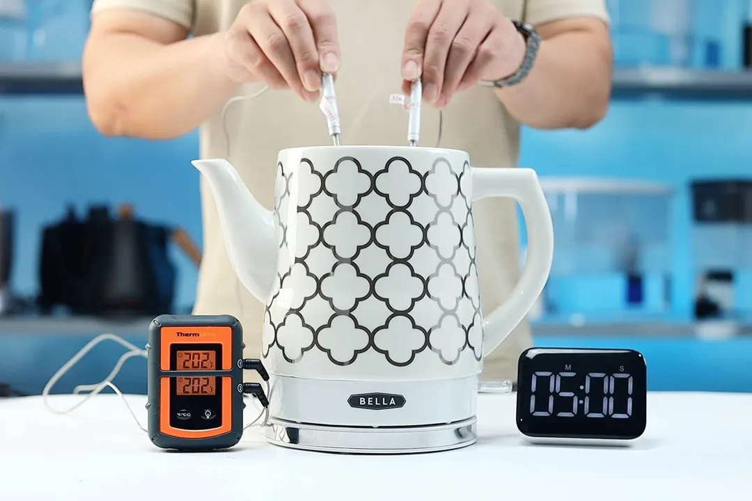 On the right is a Thermo Pro two-probe digital thermometer displaying 202°F for both probes. In the middle is the Bella Ceramic Gooseneck Electric Kettle (14745) with 1.5 liters of water and two probes inside. On the right is a digital timer displaying 5 minutes on the countdown.