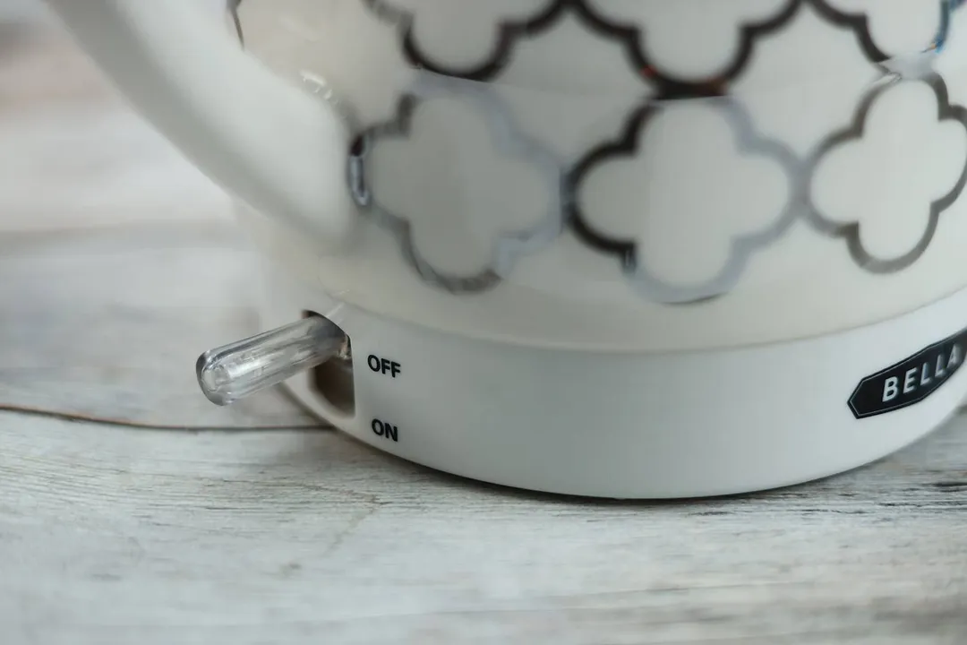 The clear plastic power switch of the Bella Ceramic Gooseneck Electric Kettle (14745).
