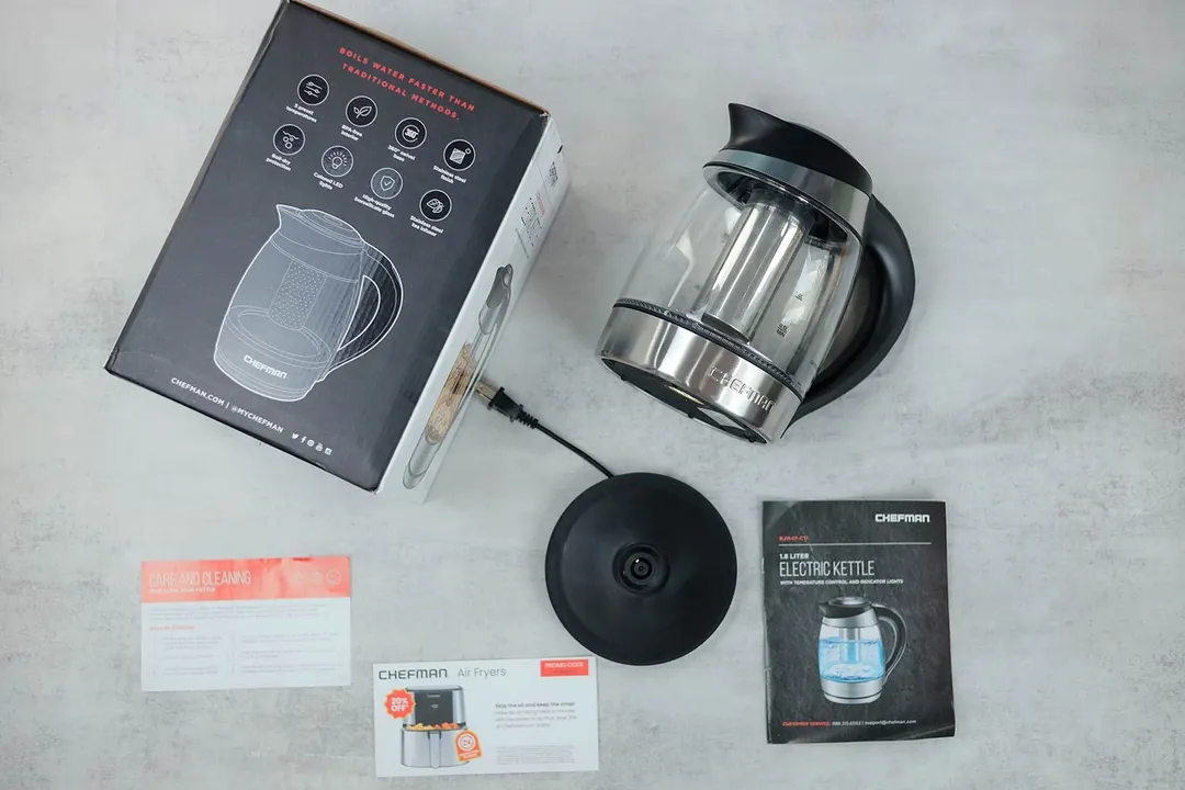 On the upper right is the Chefman Electric Kettle with Temperature Control (RJ11-17-CTI-RL). On the left is a cardboard box. Below the kettle, on the right is an instruction manual and on the left is the power base.