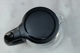 The pop-up lid of the Comfee Glass Electric Kettle (CEKG003).