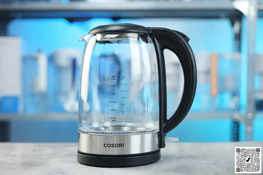 The carafe of the Cosori Glass Electric Kettle (GK172-CO) sitting on top of its power base.