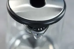 The glass V-shaped spout of the Dezin Electric Glass Kettle DZ380.
