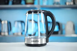 The carafe of the Dezin Electric Glass Kettle DZ380 sitting on top of its power base.