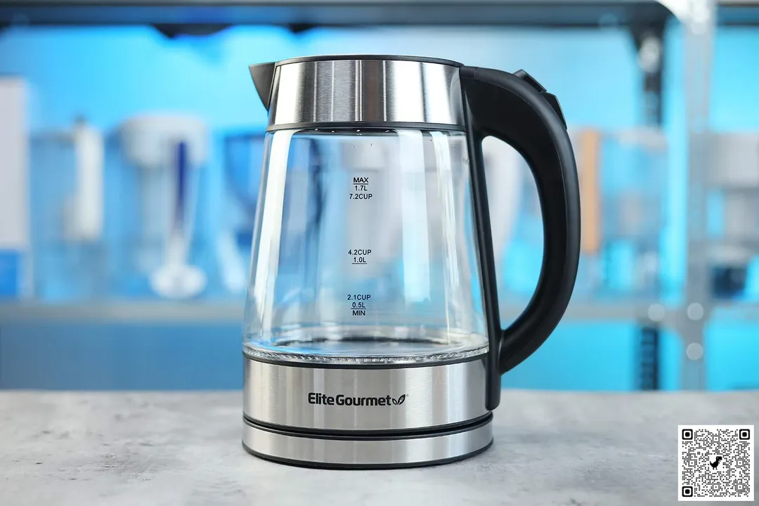 The carafe of the Elite Gourmet Electric Glass Kettle (EKT-602) sitting on top of its power base.