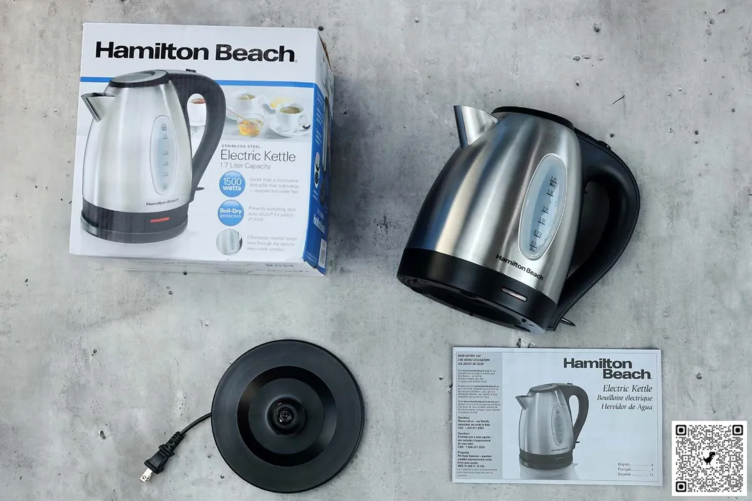 On the upper right is the Hamilton Beach Electric Kettle (40880). On the left is a cardboard box. Below the kettle, on the right is an instruction manual and on the left is the power base.