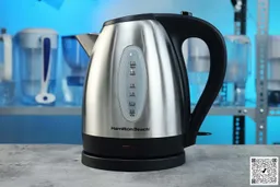 The carafe of the Hamilton Beach Electric Kettle (40880) sitting on top of its power base.