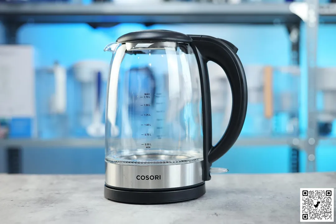 The carafe of the Cosori Original Electric Glass Kettle (GK172-CO) sitting on top of its power base.