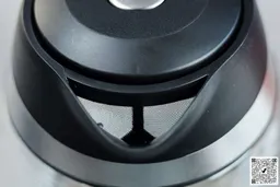 The mesh filter attached to the plastic black V-shaped spout of the Mueller Ultra Electric Kettle (M99S).