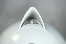 The plastic V-shaped spout of the Ovente Electric Kettle KP72W.
