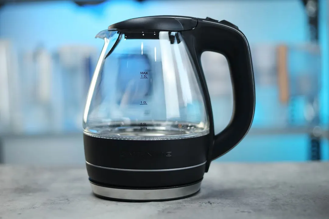 The carafe of the Ovente Electric Glass Kettle (KG83B) sitting on top of its power base.