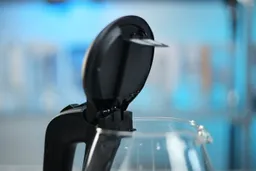 The pop-up lid of the Ovente Electric Glass Kettle (KG83B) opens at an 80° angle.
