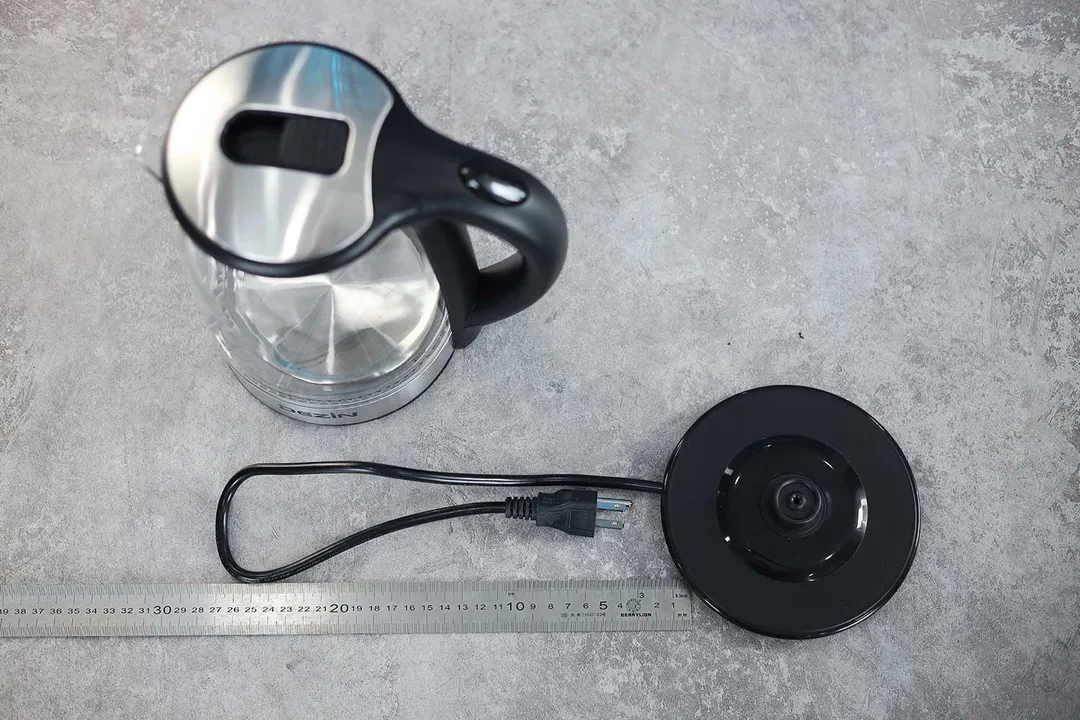 The three-pronged round power cord of the Dezin Electric Glass Kettle DZ380 is 21.46 inches long (54.5 cm).