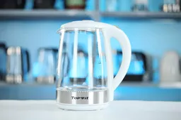 The carafe of the Topwit Glass Electric Tea Kettle T630 sitting on top of its power base.