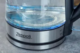 The heating plate with a LED ring around it glowing blue of the Zeppoli Electric Kettle ZPL-KETTLE.