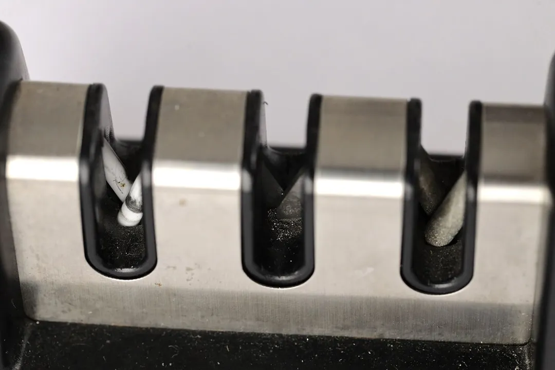 Medal residue on the three abrasive slots on the Cubikook knife sharpener