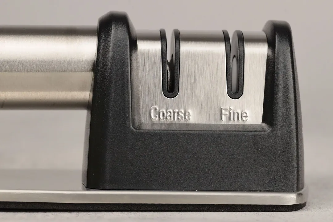 The working section of the Priority Chef with 2 abrasive slots on a plastic frame and part of the handle and base
