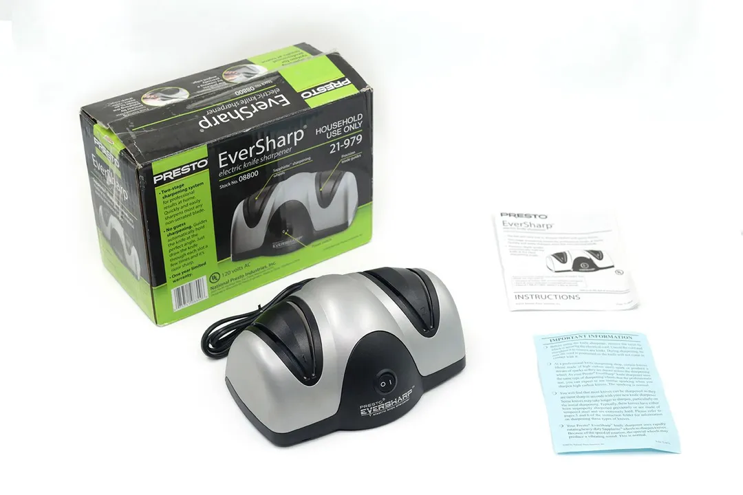 The Presto Eversharp electric knife sharpener next to its package box, instruction manual, and a leaflet