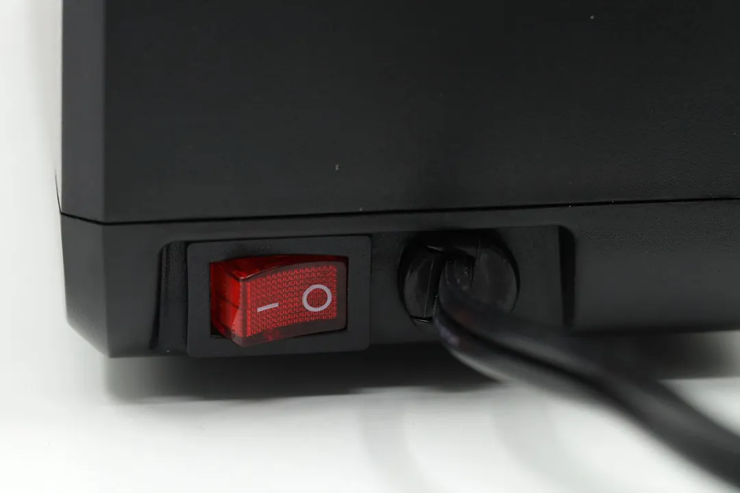 A corner of the Narcissus, shown are a power switch and the root of the power cord.