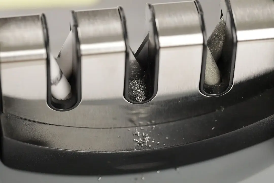 Metal residue on the abrasive slots of a manual sharpener