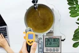 The reading of the Etekcity Lasergrip 1080 from 12 inches away from a hot pan of cooking oil: 374.7°F.