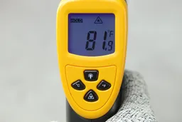 The LCD screen panel of the EtekCity Lasergrip 800 with the backlight turned on. The screen currently displays 81.9°F.