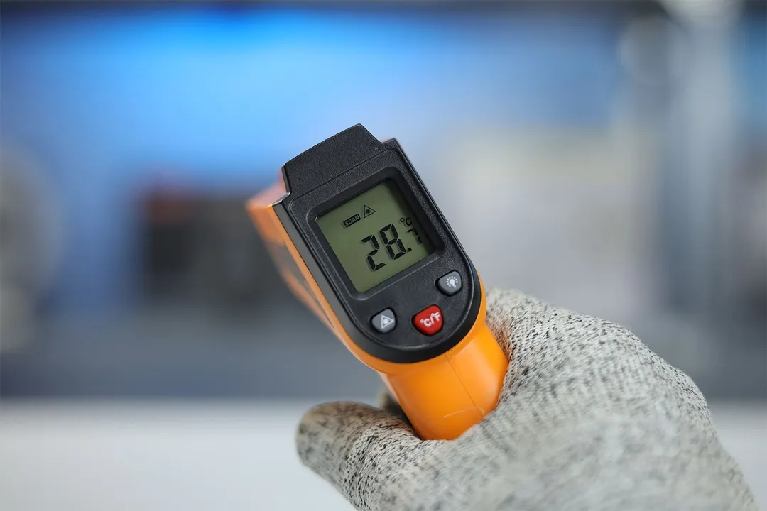 The LCD display panel of the Helect IR thermometer with the backlight turned off. The screen reads 28.7°C