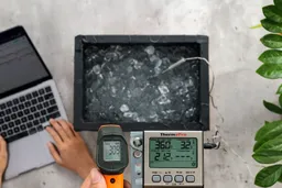 The Klein Tools IR1 measuring an ice bath from a distance of 16 inches, with the screen displaying 30.9°F.