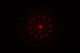 The Mecurate IRT600A laser dot pattern in a dark room.