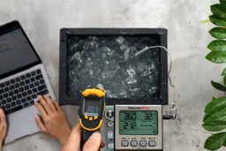 The Sovarcate HS960D measuring the temperature of an ice chest from 16 inches away. The screen reads 30.7°F.