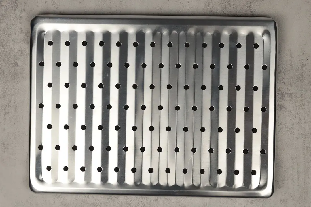 A silver baking rack of the stainless steel BLACK+DECKER CTO6335S Convection Toaster Oven on a grey background.