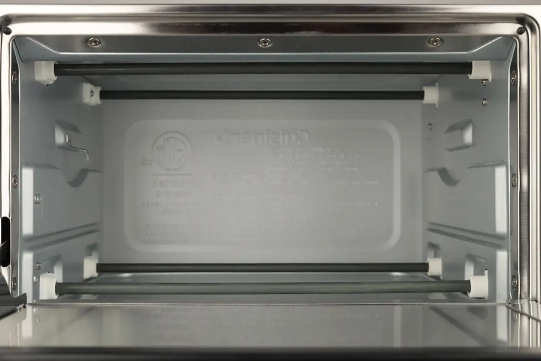The Cuisinart TOB-40N Toaster Oven’s cooking chamber has 4 nichrome heating elements, 2 guide rails, and a safety hook.