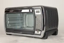 The front of a closed stainless steel Oster TSSTTVMNDG-SHP-2 6-Slice Large Digital Countertop Convection Toaster Oven