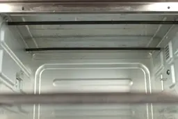 The stained cooking chamber ceiling of the Toshiba AC25CEW-BS Convection Toaster Oven.