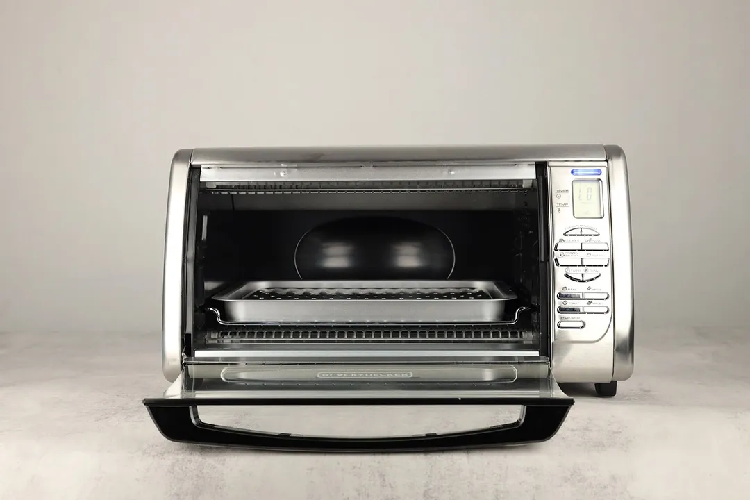 The front of an opened BLACK+DECKER CTO6335S Convection Toaster Oven with a baking rack, a baking pan, and a broiling rack