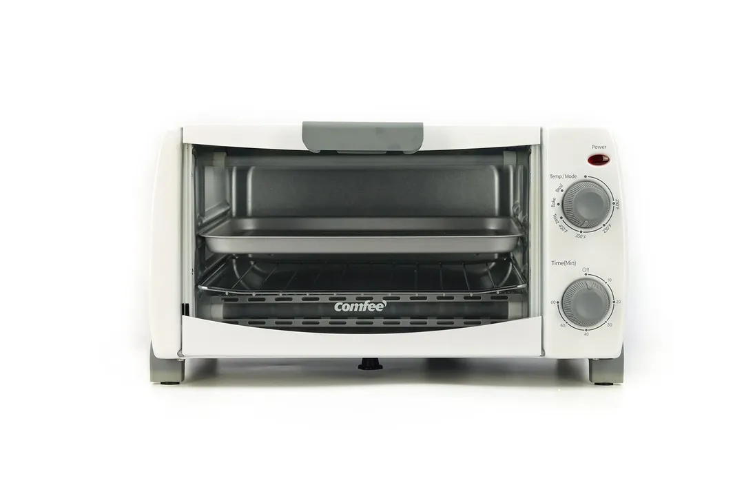 The front of a closed white COMFEE CFO-BB101 Compact Countertop Toaster Oven on a white background.