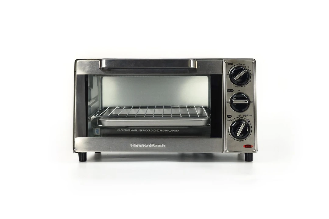 The front of a closed stainless steel Hamilton Beach 31401 4-Slice Capacity Countertop Toaster Oven on a white background.