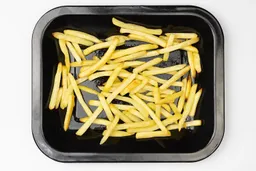 Pieces of baked french fries using the Oster TSSTTVMNDG-SHP-2 Toaster Oven on an enamel baking pan on a white background.