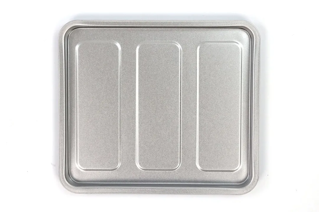 A silver baking pan of the Black+Decker TO1760SS 4-Slice Natural Convection Toaster Oven on a white background.