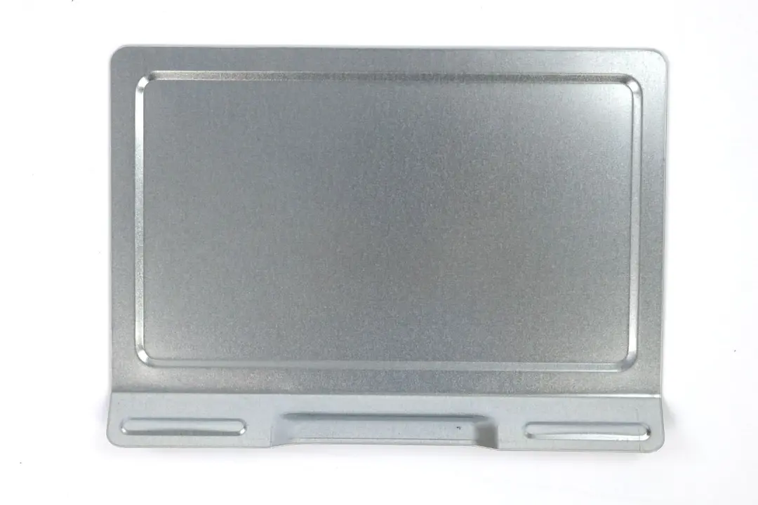 A silver removable crumb tray of the Black+Decker TO1760SS 4-Slice Natural Convection Toaster Oven on a white background.
