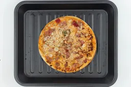 Cosori Air Fryer Toaster Oven PizzaA toaster oven baked 9-inch thick-crust meat pizza with cheese, onions, and green bell peppers on top inside a baking pan.